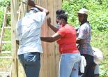 PR Officer Shadae Norman Assists Placement of Ply on Structure