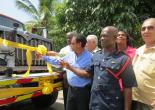 Local Goverment Minister and Community Development, Hon. Noel Arscott (Centre) delivers brand new fire engine to Clarendon. With him are (from left) Mayor of May Pen, Councillor Scean Barnswell (left); Member of Parliament for Central Clarendon, Mr. Mike Henry and Assistant Commissioner of the Jamaica Fire Brigade, John Forester.